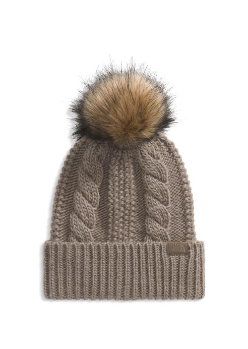 Tan knit beanie with pom pom.