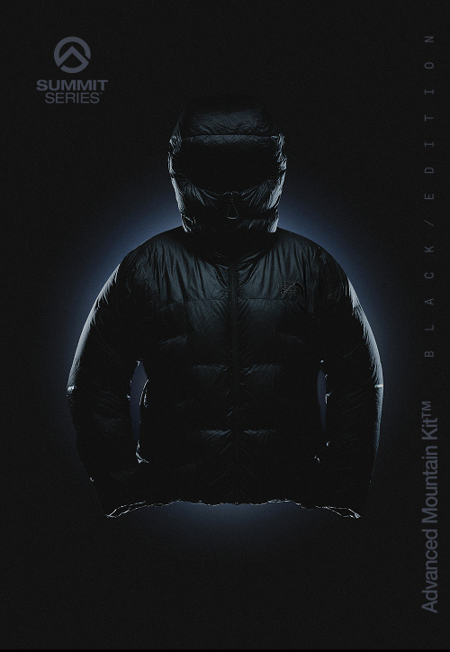 Men's Summit Series Cloud Down AMK Parka with blurred spotlight in the top center.