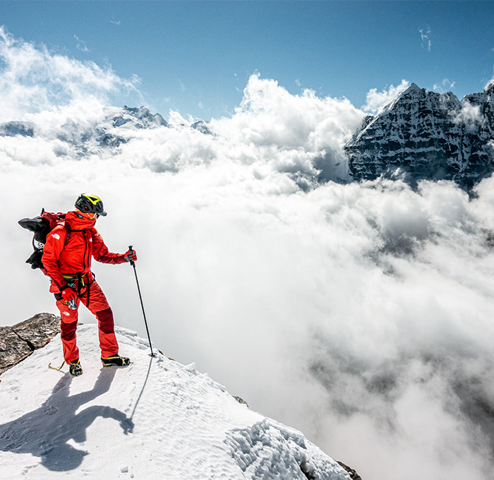 Person climbing a mountain.
