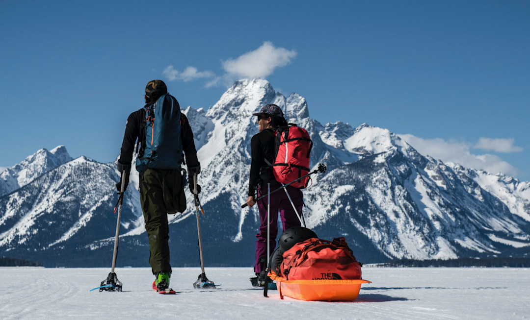 Vasu Sojitra and Emile Zynobia share a laugh across Jackson Lake on their approach to Mt. Moran.