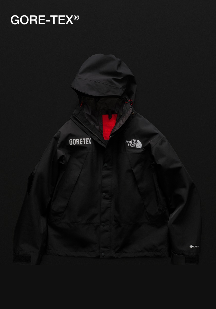 Studio laydown shot of a The North Face GORE-TEX Mountain Jacket. Text: GORE-TEX®