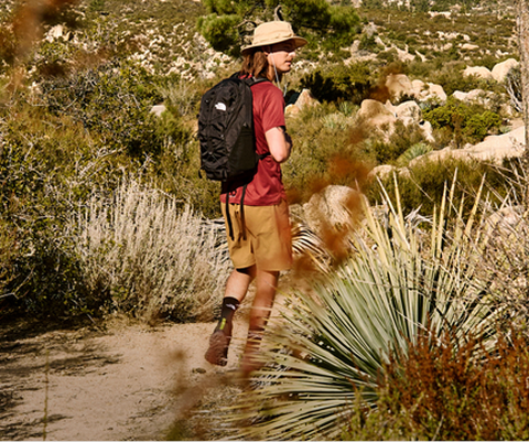 A man hikes in his The North Face gear and backpack.