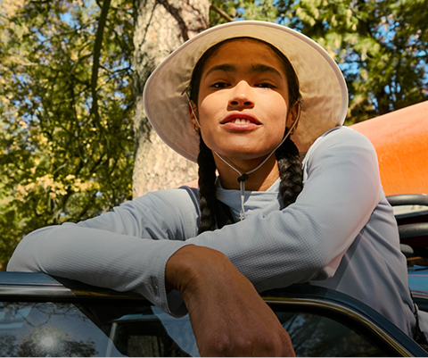 A woman camps in her The North Face sun  gear. 