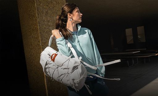 A girl wearing a white backpack