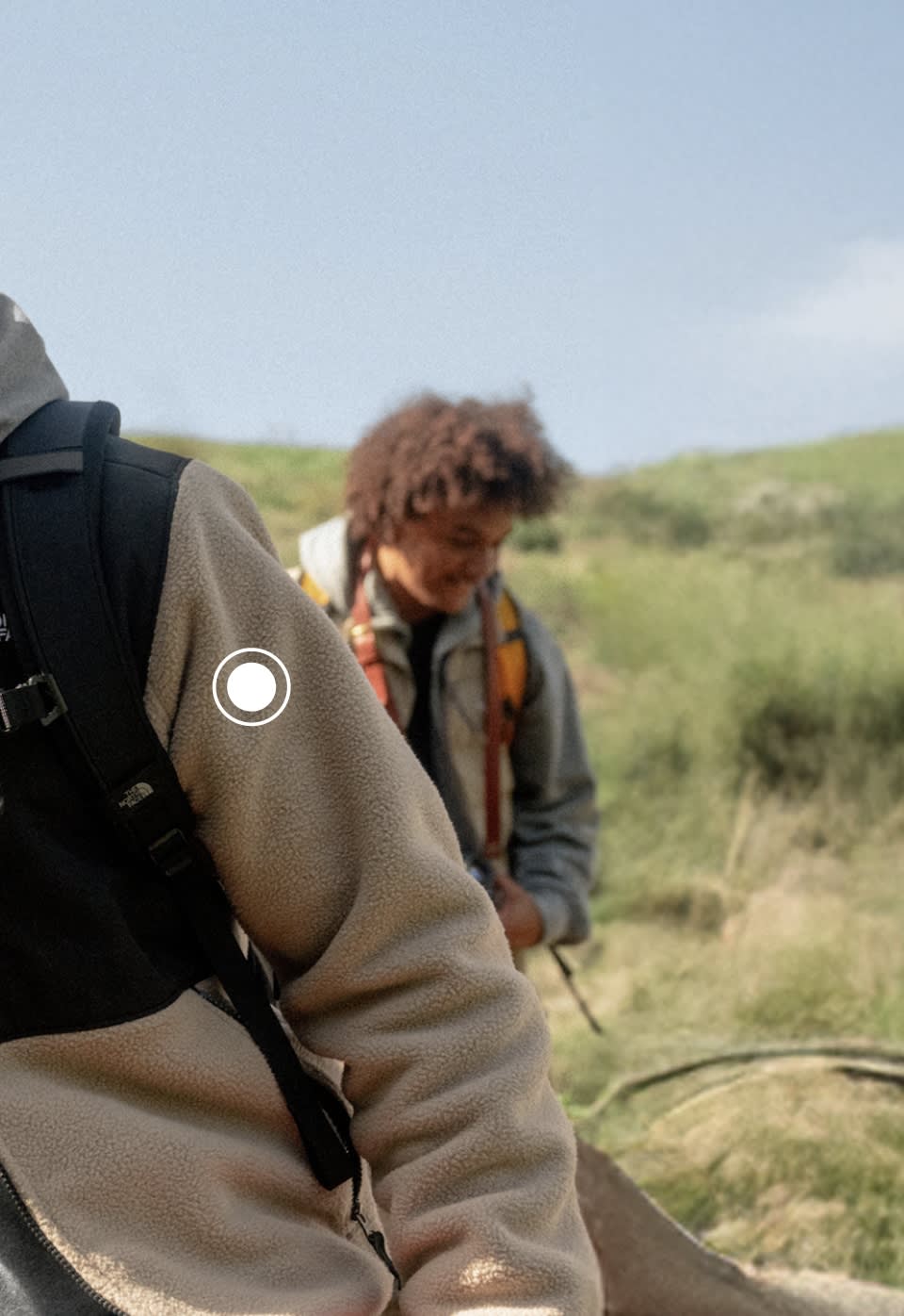 A man wearing a grey Denali jacket from The North Face