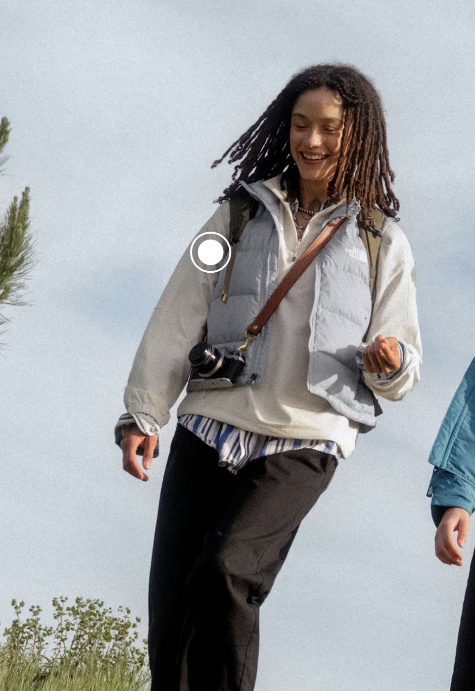 A woman wearing a blue vest from The North Face