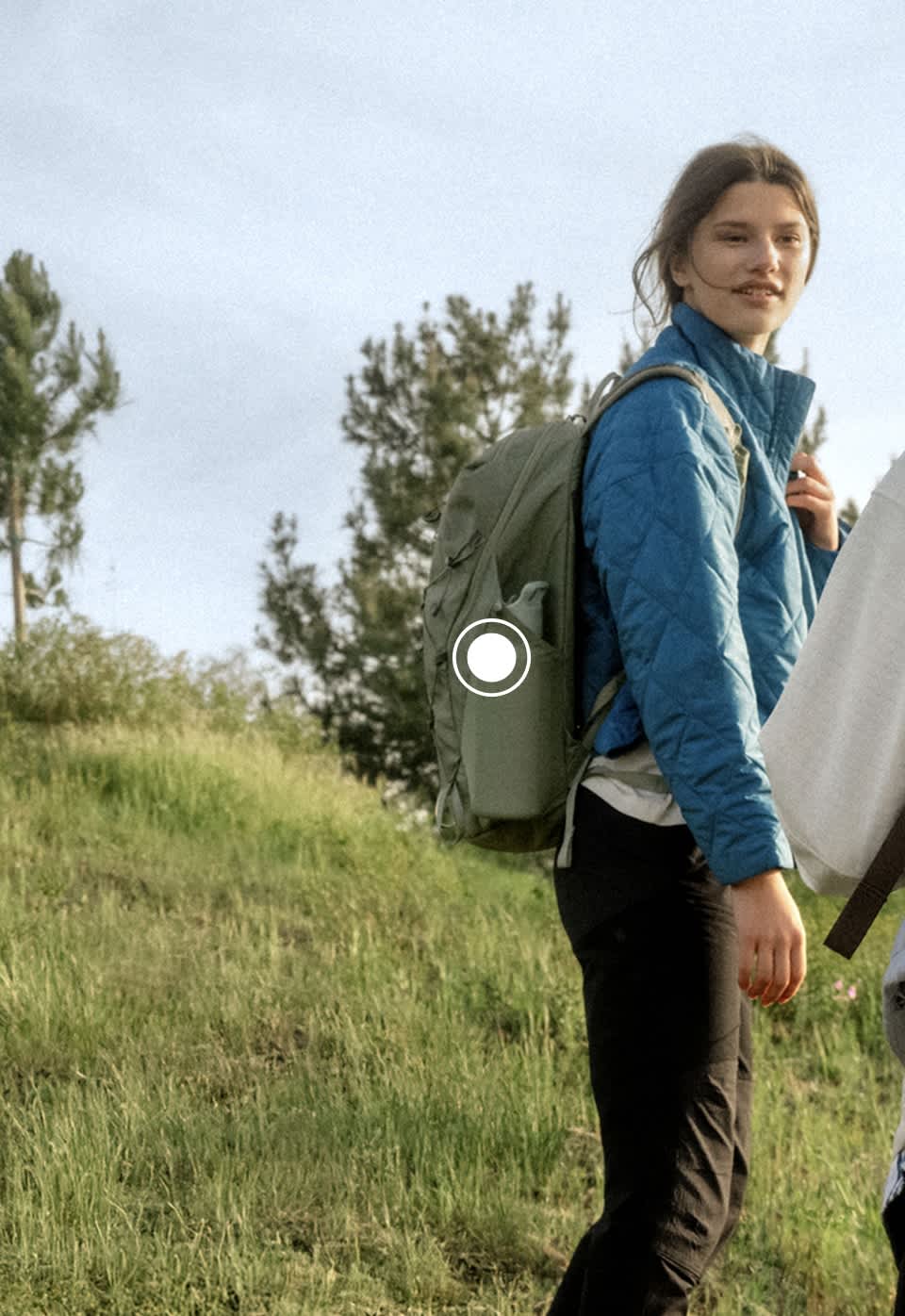 A woman wearing a Borealis Trail backpack from The North Face