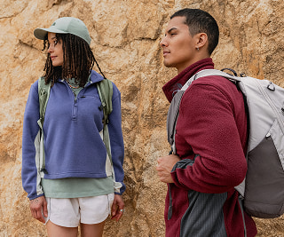 A man and woman on a hike in The North Face gear.
