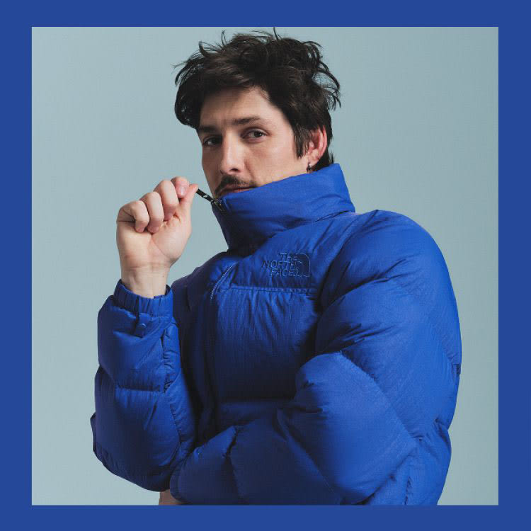 A man in a blue Nuptse all the way zipped, the image has a blue frame around it. A woman in a white beanie and matching Nuptse, the image has a white frame around it. A man in a matching green Borealis and fleece, the image has a green frame around it.