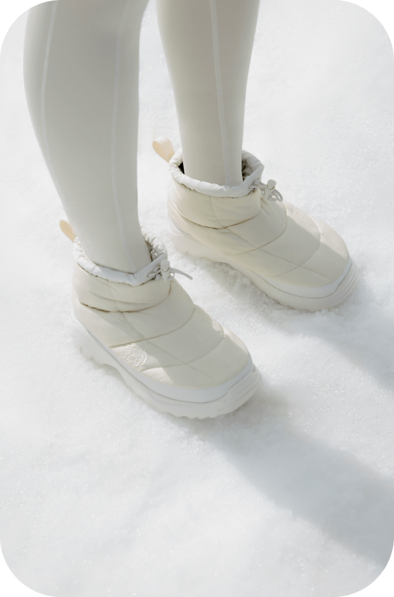 White The North Face x SKIMS boots.