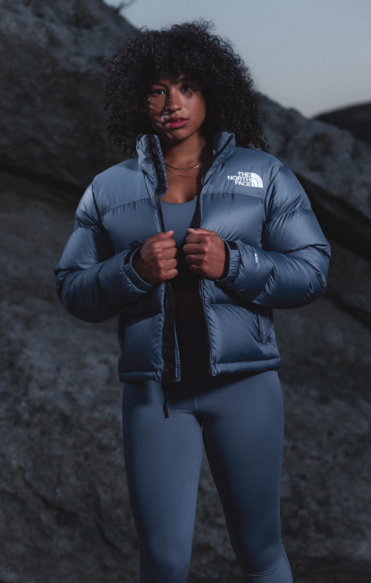 A woman wearing a monochromatic blue outfit from The North Face