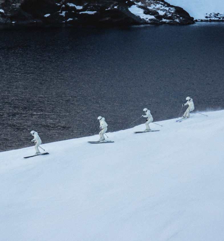 A group of skiers in The North Face x SKIMS collection