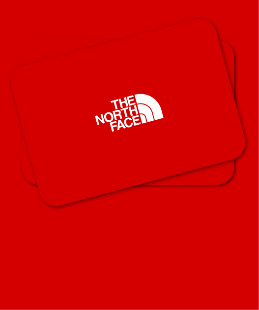 A pile of red colored gift cards on a red background.