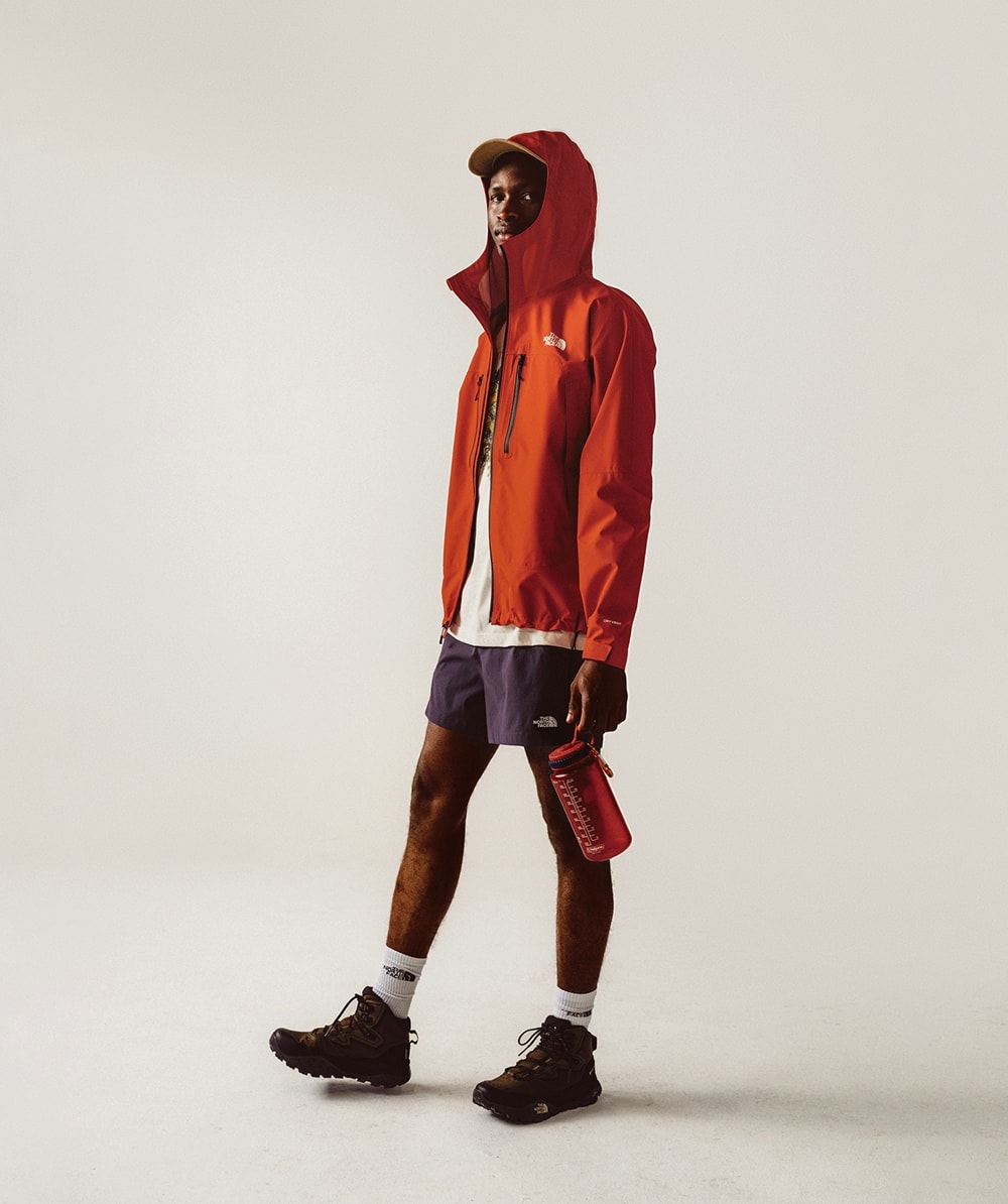 Man posing standing wearing red rain jacket