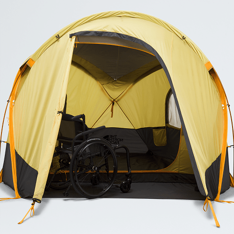 Image of the Wawona 3 tent, unzipped with a wheelchair inside.