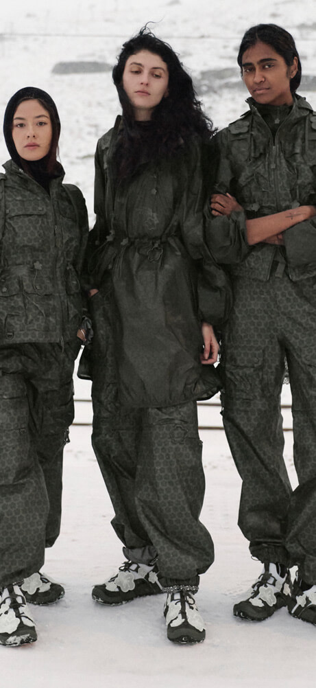 Three models wearing The North Face x Cecilie Bahnsen collection standing together.