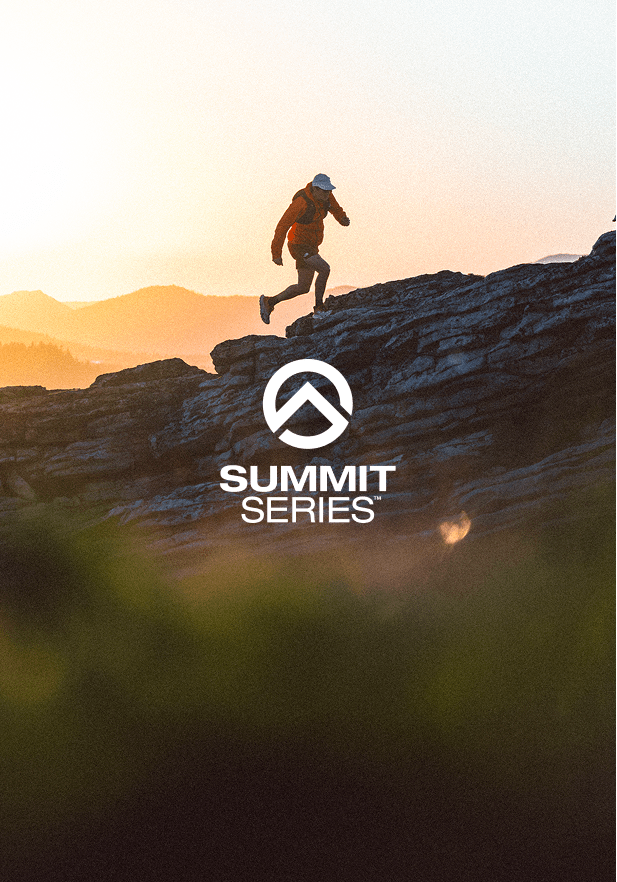 man running up a mountain at sunset with the summit series logo beneath him. 