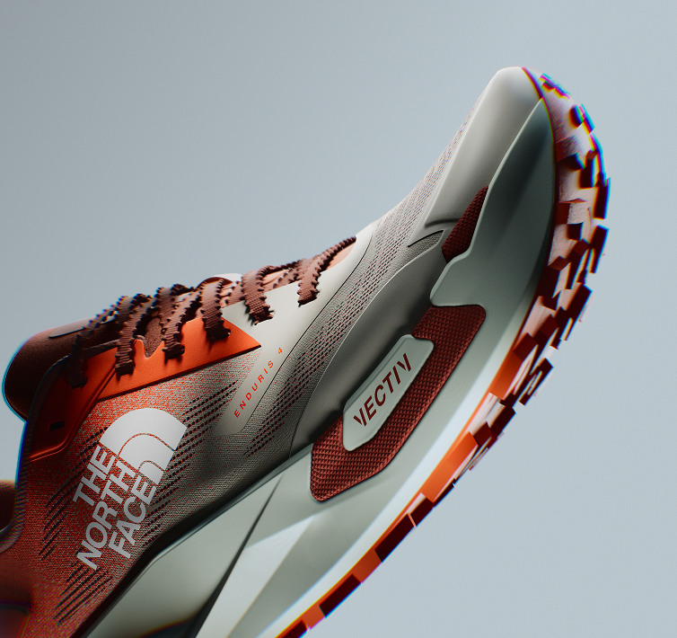 nner side view of orange VECTIV™ Enduris 4 on gray background. 