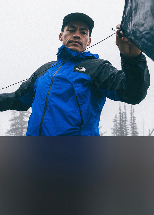 A man wearing The North Face Ridgelite jacket in blue.
