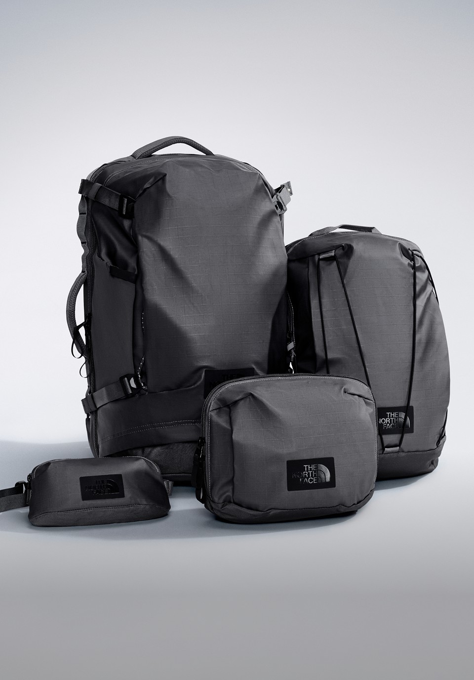 All four Voyager Packs stood up in a grey studio background.