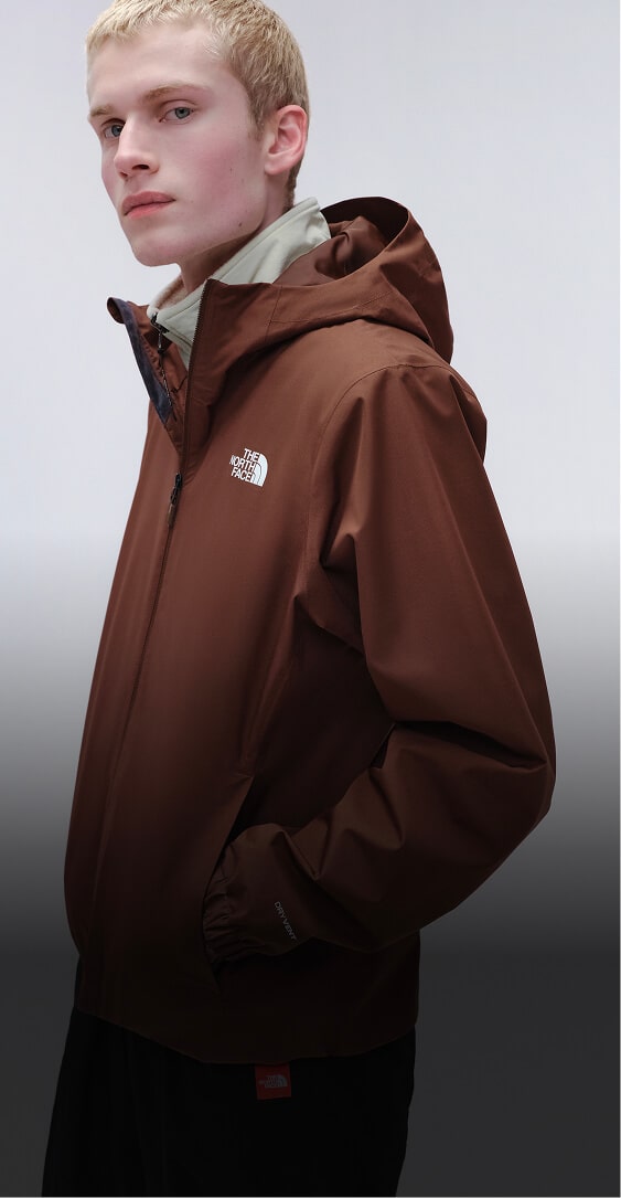 Man in brown jacket. 