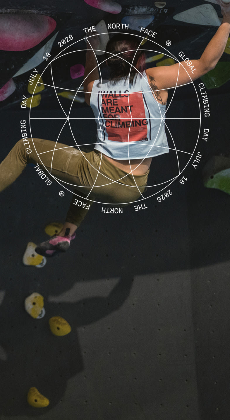 Woman on a climbing wall with The North Face Climbing Day Graphic on the image.