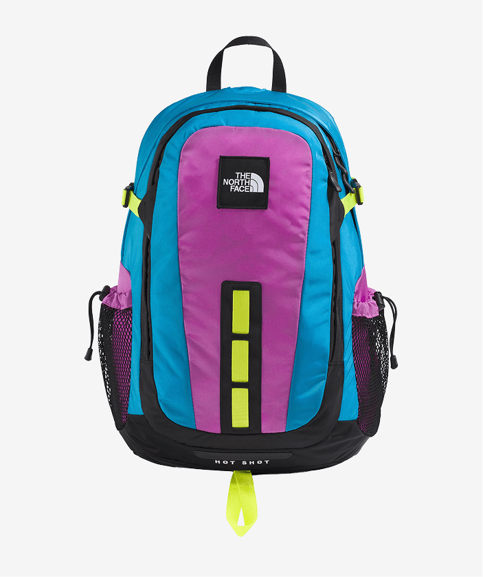 Pink and blue Hot Shot backpack on light gray background.