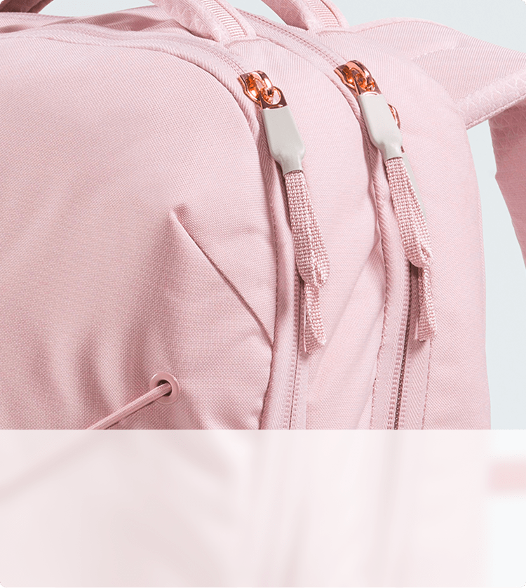 Closeup of metallic accents on a pink backpack.