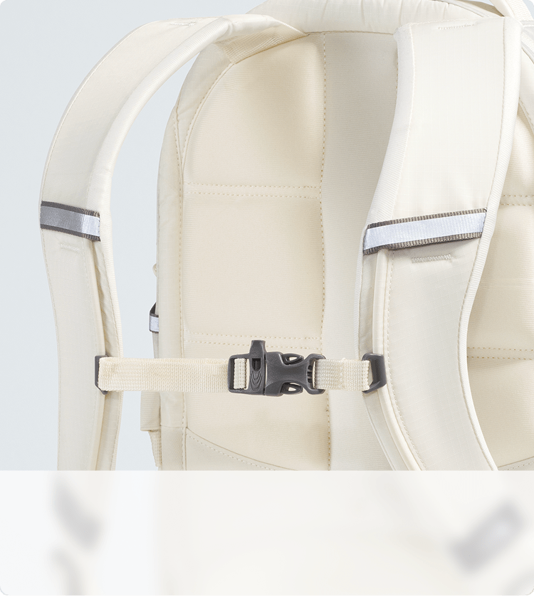 Closeup shot of a white backpack showing the suspension system.