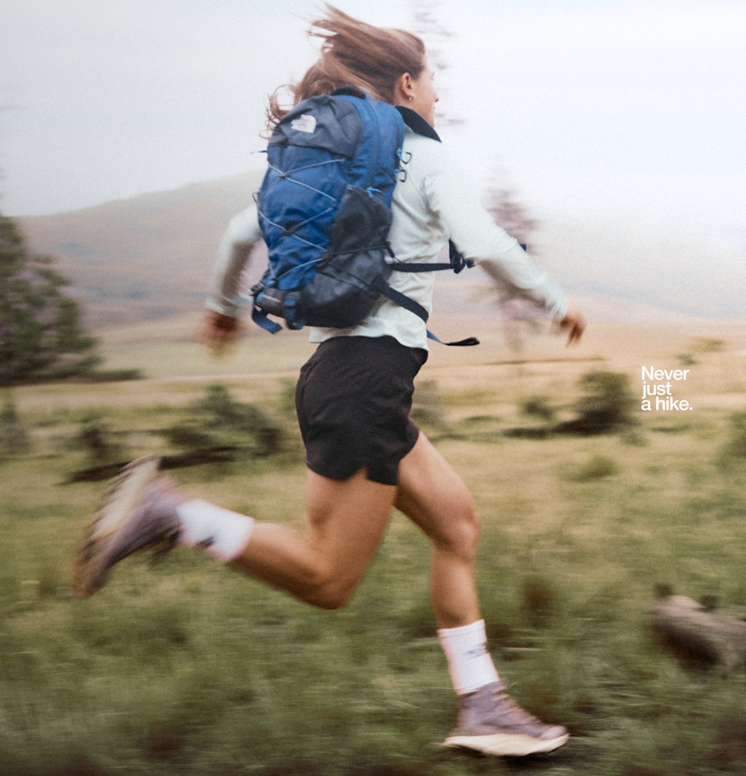 A grid of different people wearing various hiking gear, including jackets, vests and shorts. 