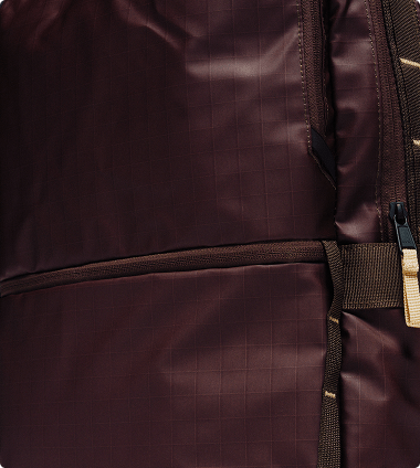 Closeup of an unzipped Base Camp Voyager Daypack showing the internal sleeves.
