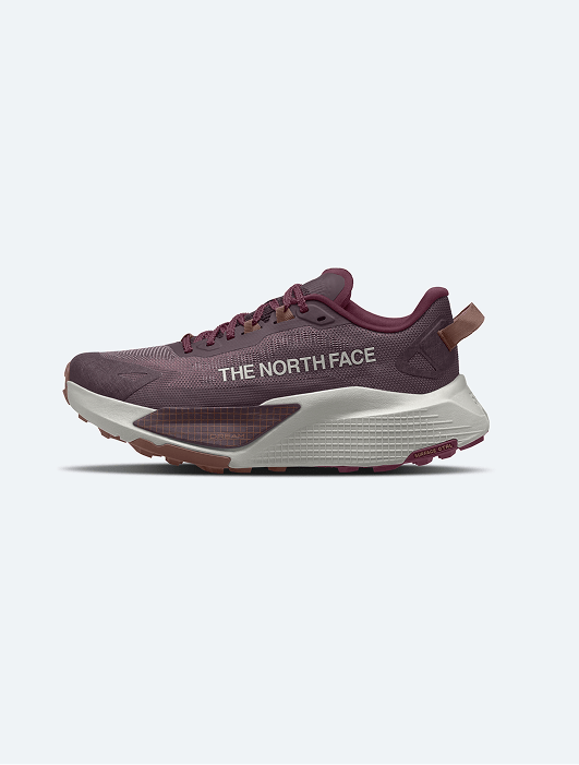An image of a purple sneaker on a grey background