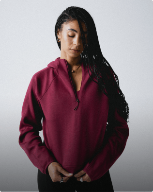 Women looking down wearing Jaida 1/4 Zip Hoodie