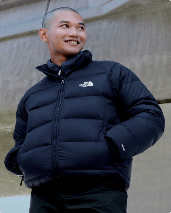A man wearing the Hydrenalite Jacket in a field