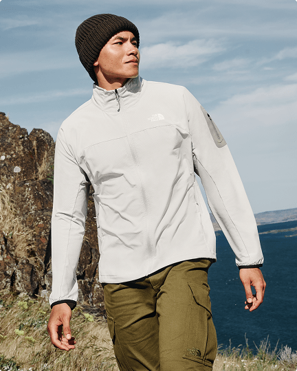 A man looking in the distance wearing a white Tek Approach 