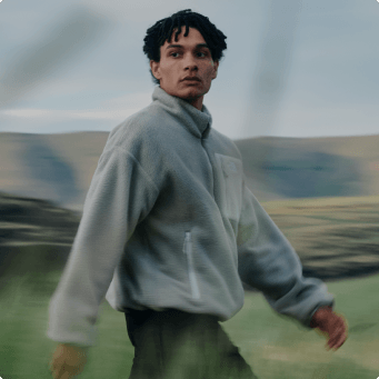 A man wearing a grey Yumiori fleece