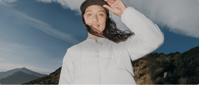 A woman wearing white Lhotse jacket
