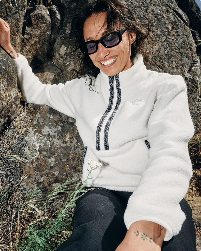 A woman wearing a white Fleeksi fleece
