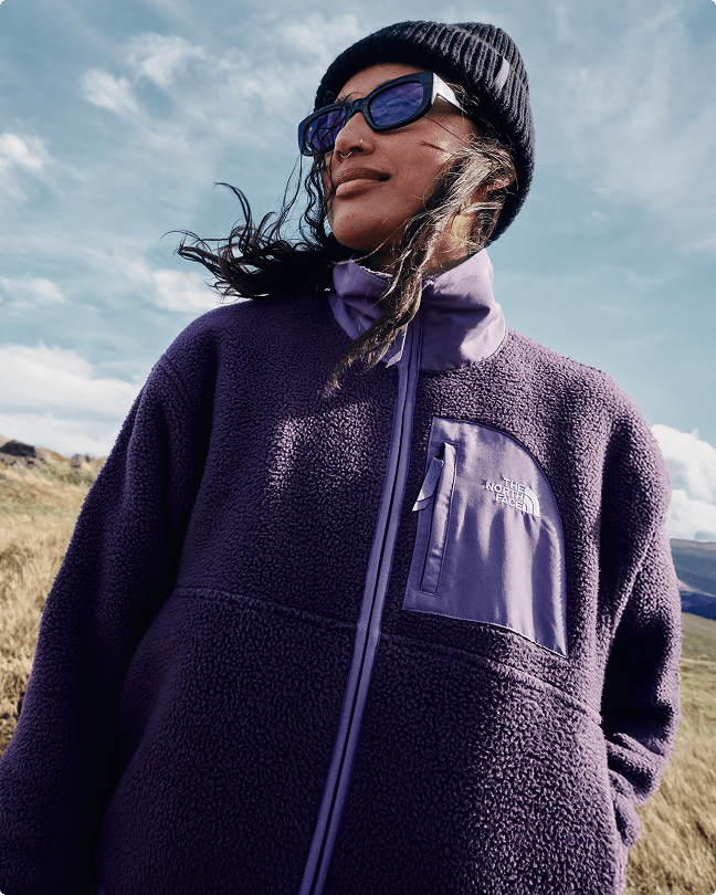 A woman wearing a purple Yumiori fleece