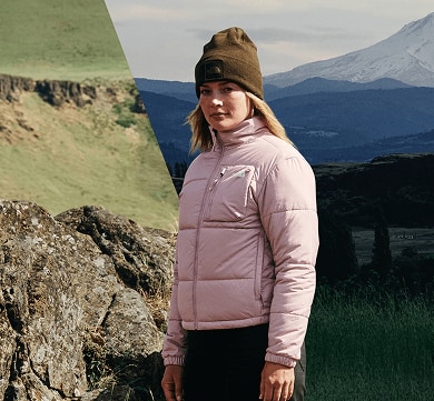 A woman standing wearing a pink Nuketo jacket