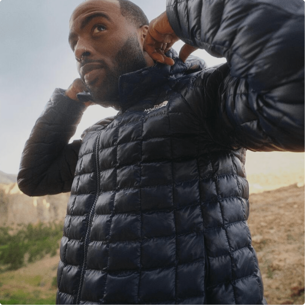 A man wearing a black insulated jacket