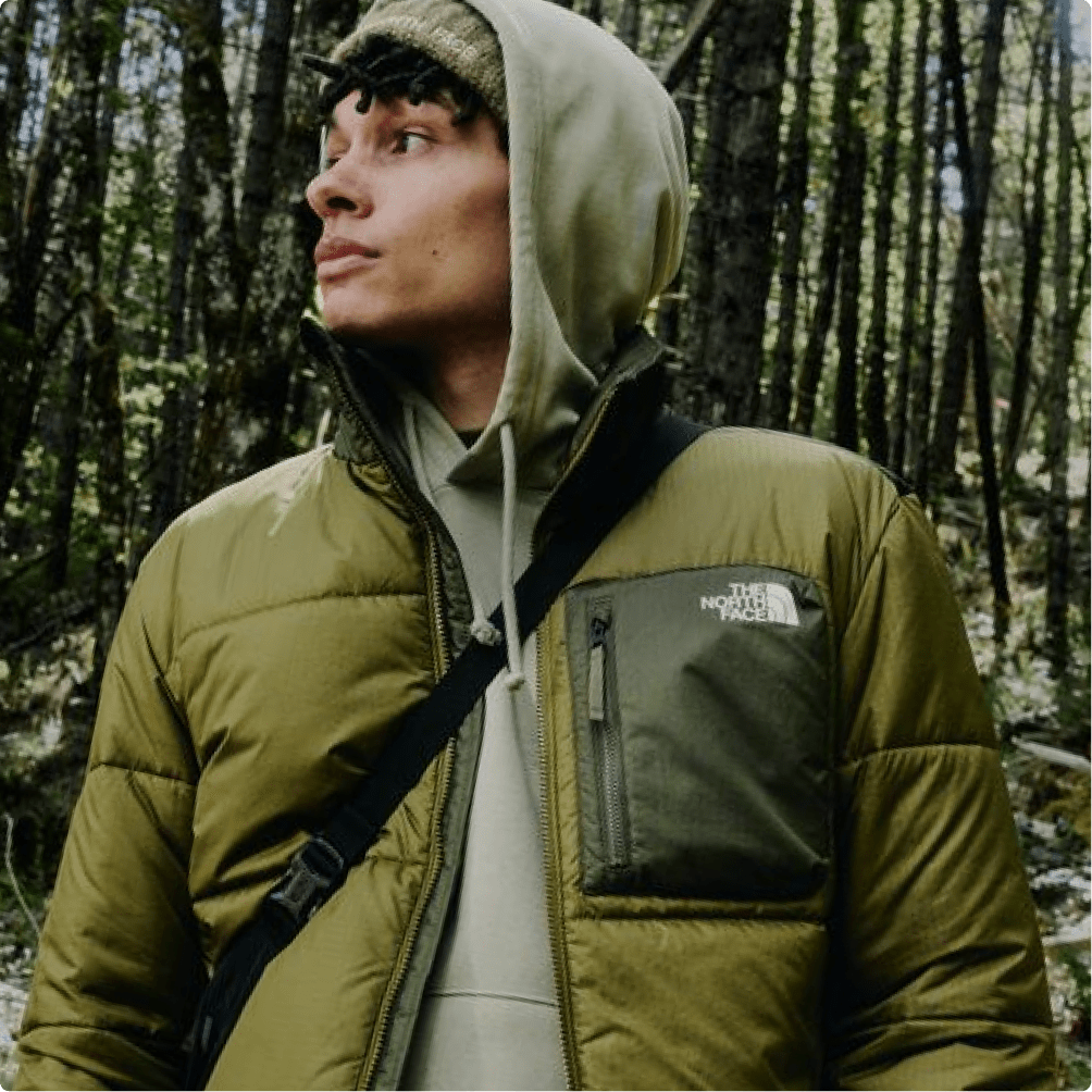A man wearing a green Nuketo jacket