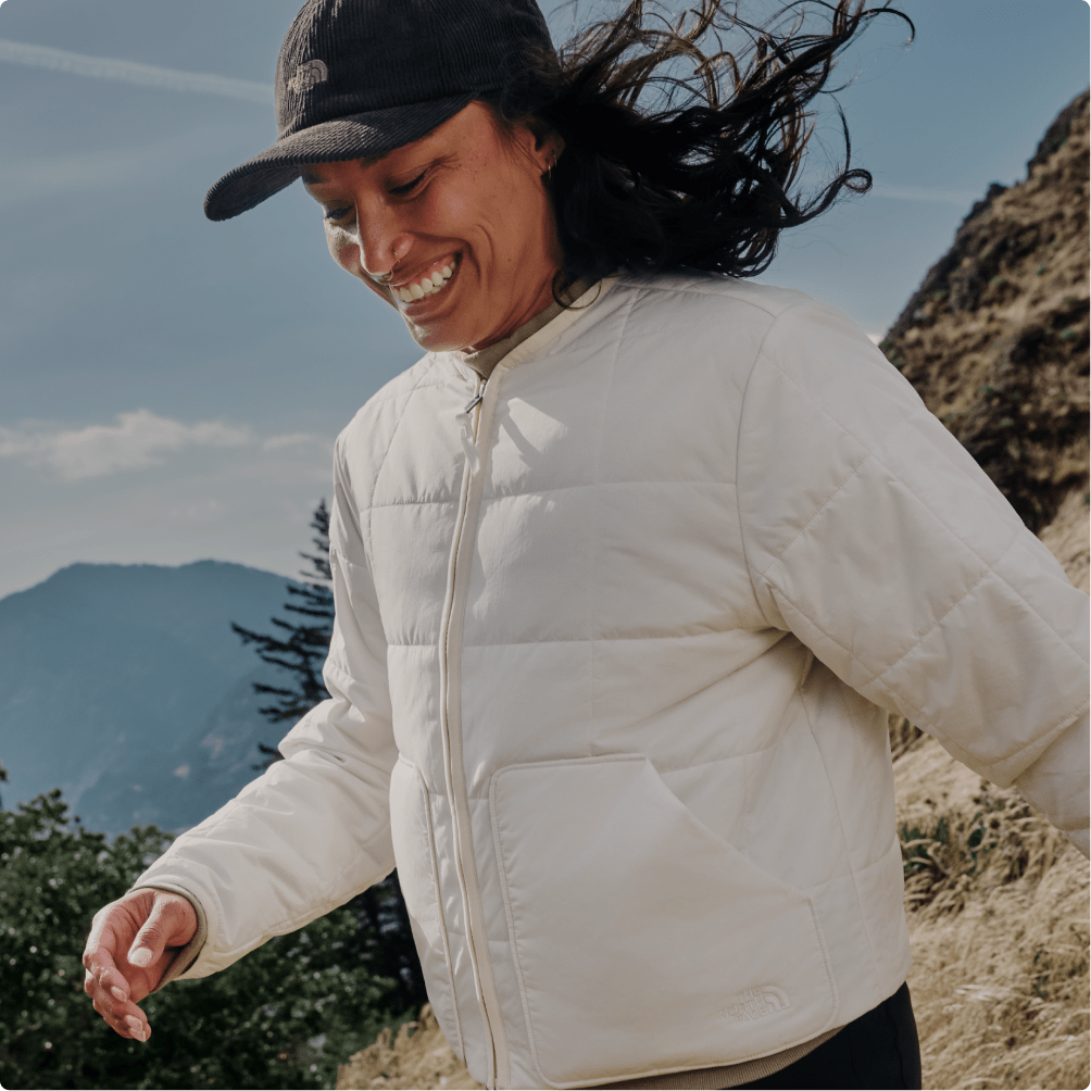A woman wearing a white Lhotse jacket