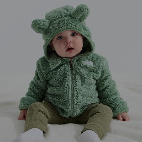 A baby wearing a North Face fleece.