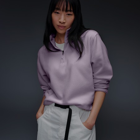 A woman wearing purple 1/4 zip.