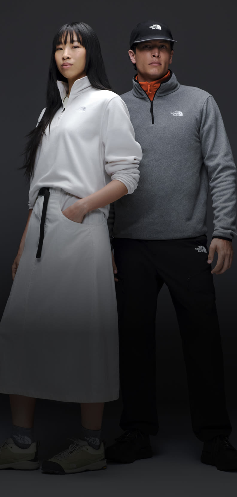 A man and a woman posing wearing Glacier fleece.