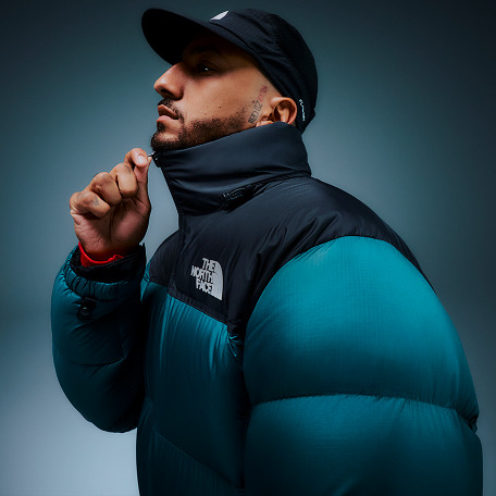 A man wearing a black insulated jacket