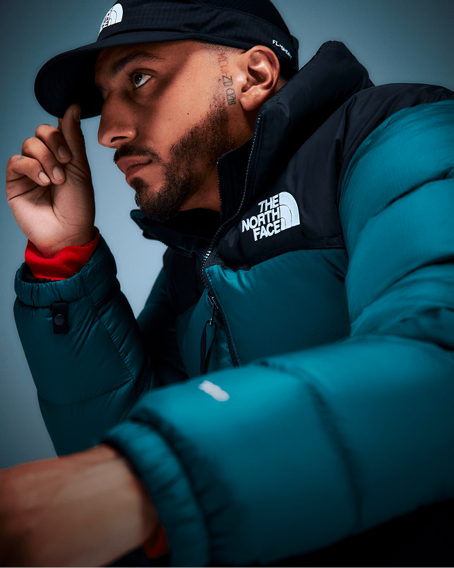 A closeup shot of a Nuptse jacket clearly showing The North Face logo.