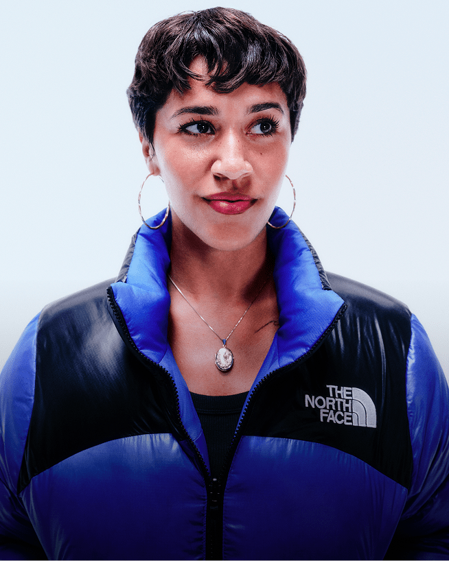 A closeup shot of a Nuptse jacket clearly showing The North Face logo. 