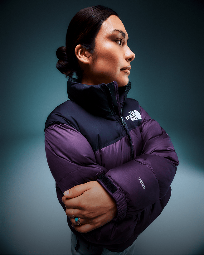A closeup shot of a Nuptse jacket clearly showing The North Face logo.